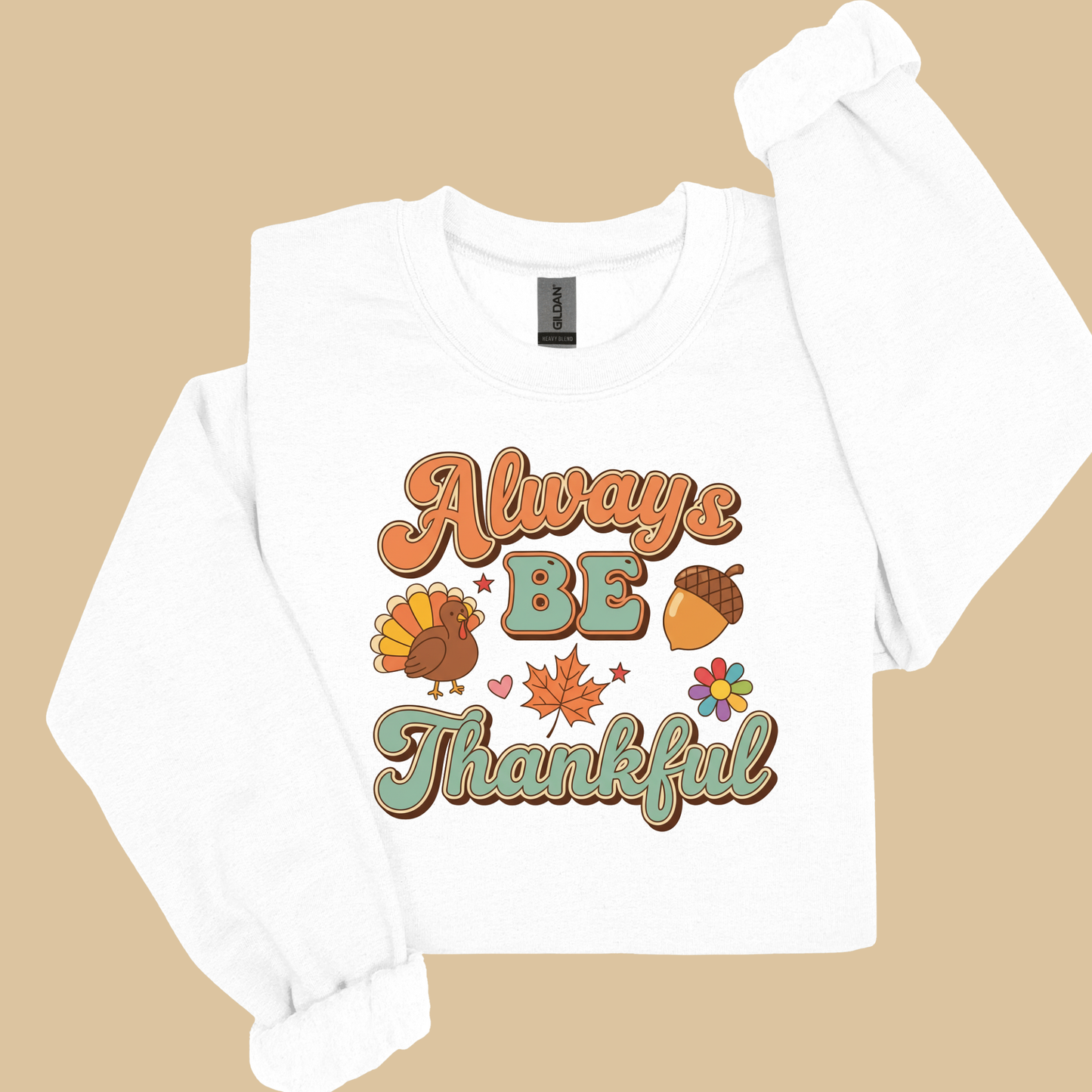White long-sleeve shirt with 'Always Be Thankful' text and graphics on a beige background Retro Thanksgiving Sweatshirt "Always Be Thankful" Fall Harvest Crewneck Sweater