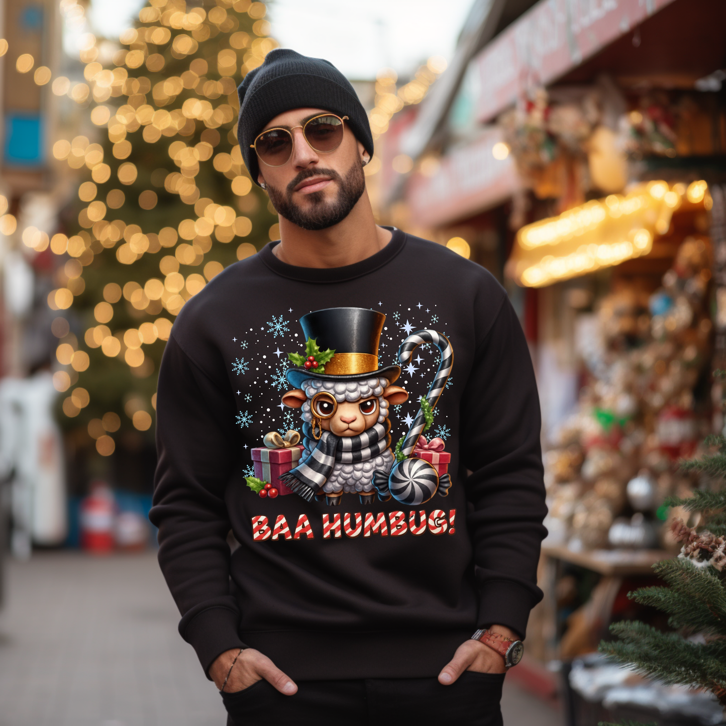 Man wearing a black sweater with a Christmas-themed design in a festive outdoor setting.