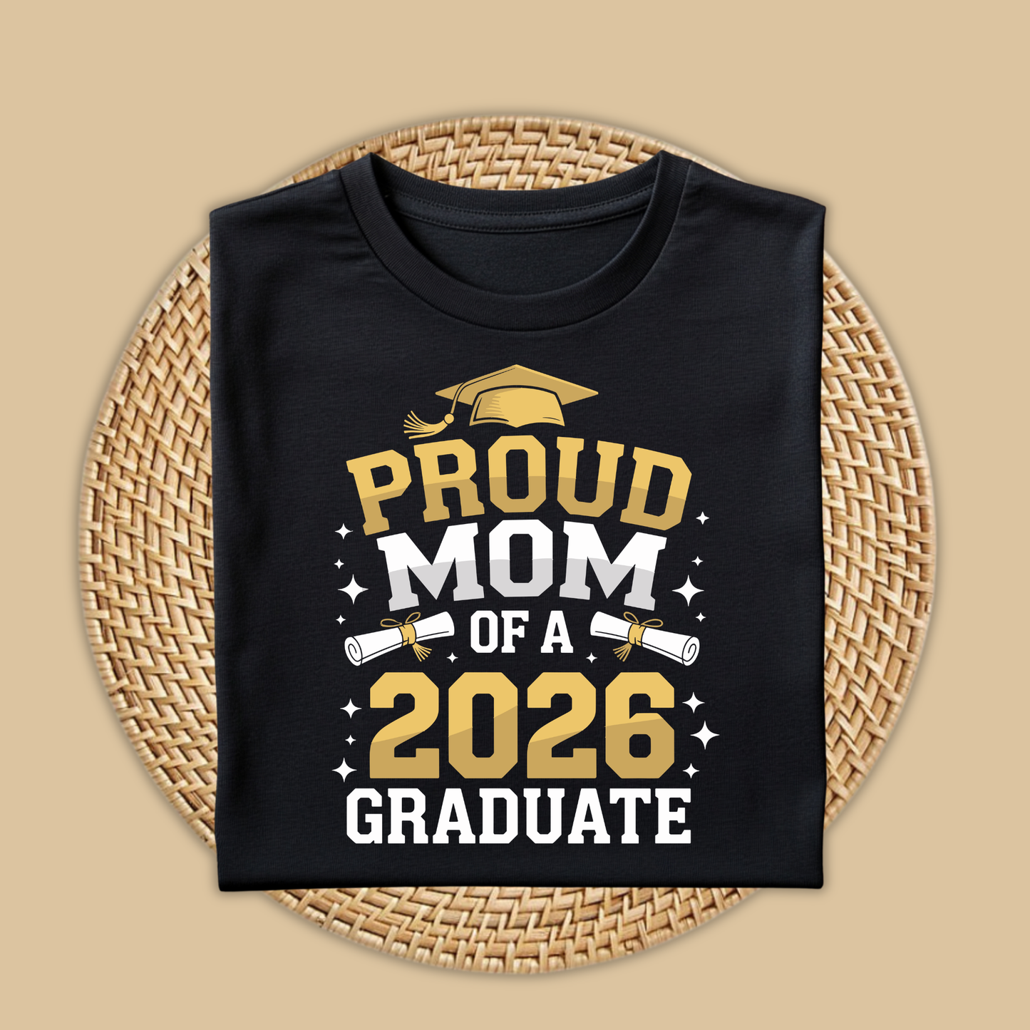 Black t-shirt with 'Proud Mom of a 2026 Graduate' text on a woven mat