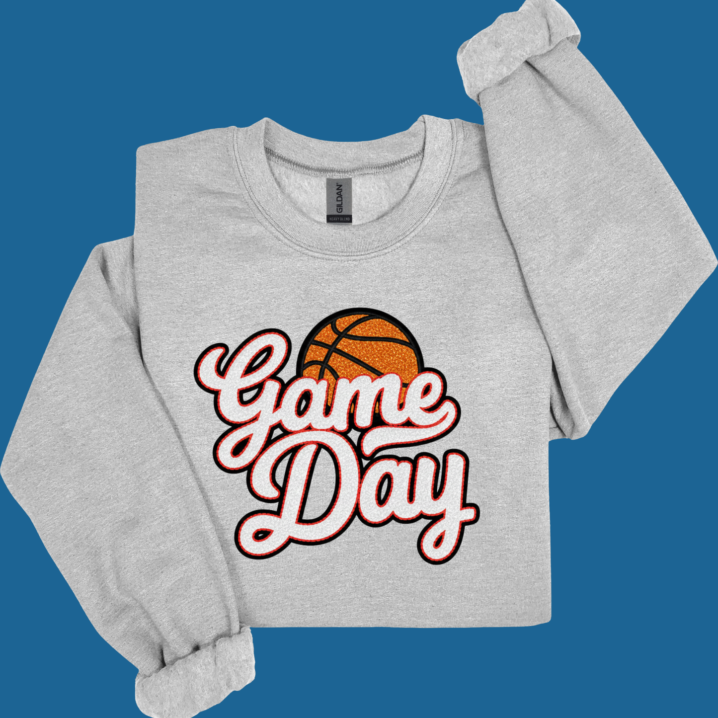 Gray sweatshirt with 'Game Day' and basketball graphic on a blue background