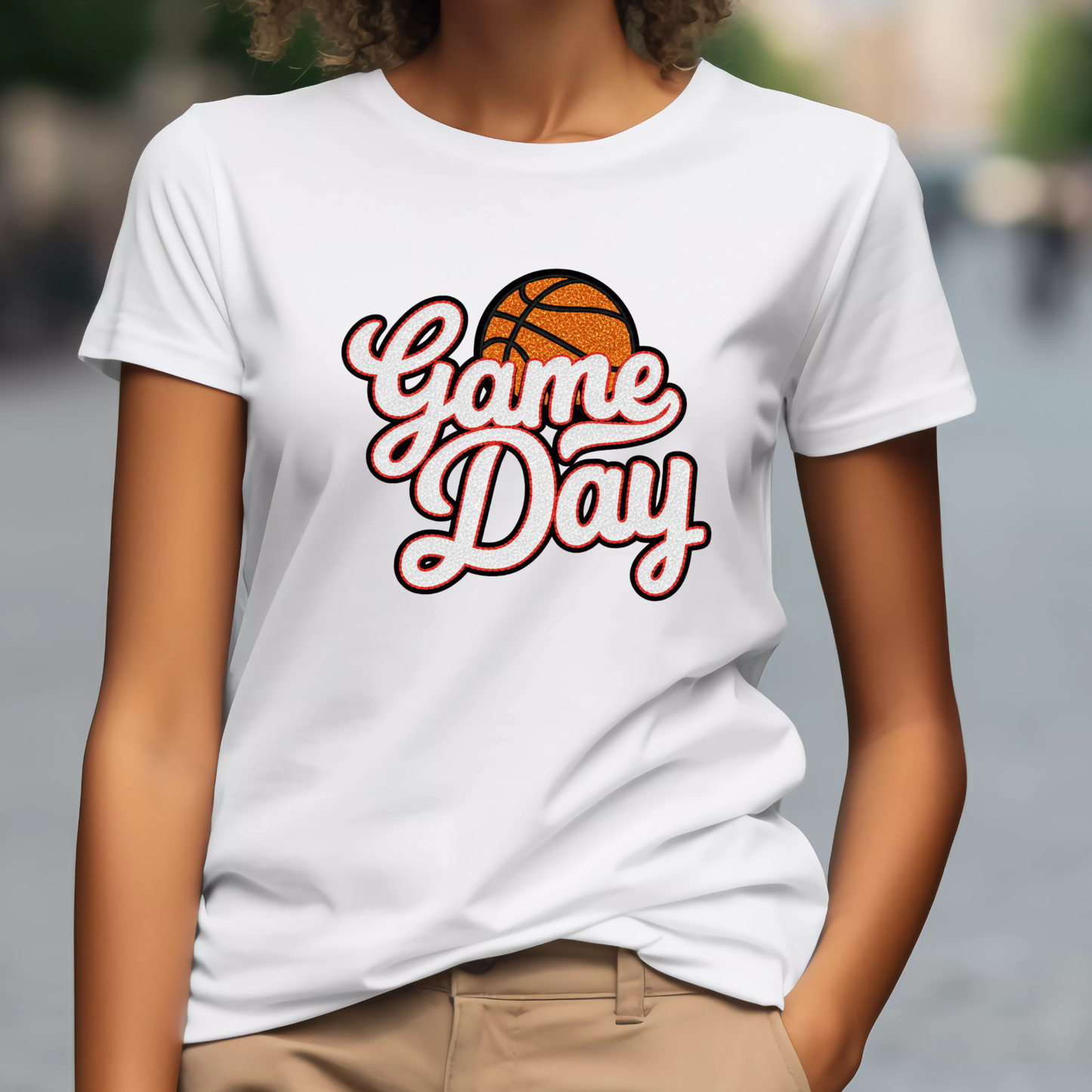Person wearing a white t-shirt with 'Game Day' and a basketball graphic.