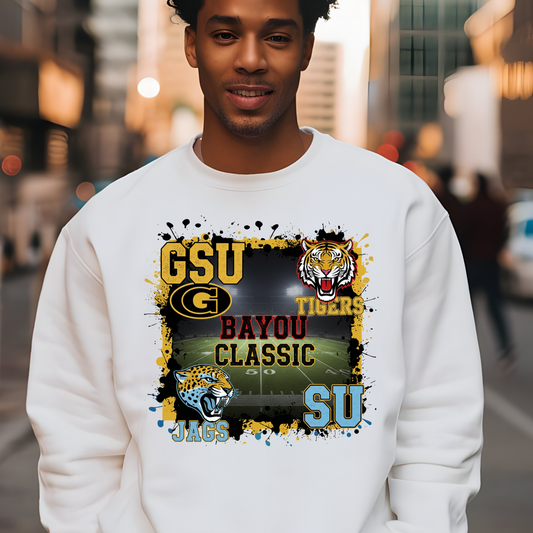 Person wearing a white sweatshirt with sports team graphics and text.  Bayou Classic Football Sweater - Grambling State GSU Tigers vs. Southern University SU Jags Sweater