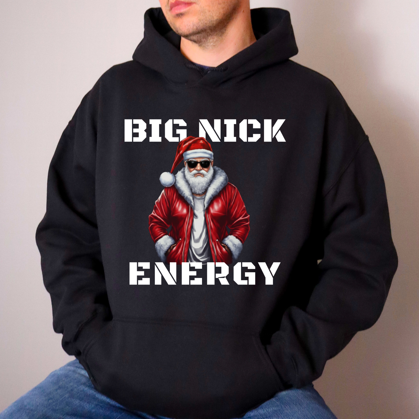 Person wearing a black hoodie with a graphic of a character in a red jacket and Santa hat, with 'BIG NICK ENERGY' text.