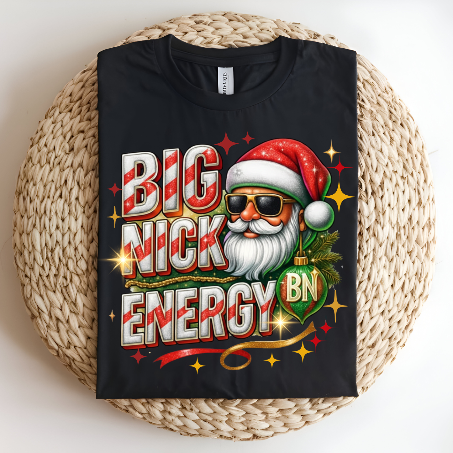 Black t-shirt with a colorful graphic of a Santa Claus-like character and text on a woven surface.