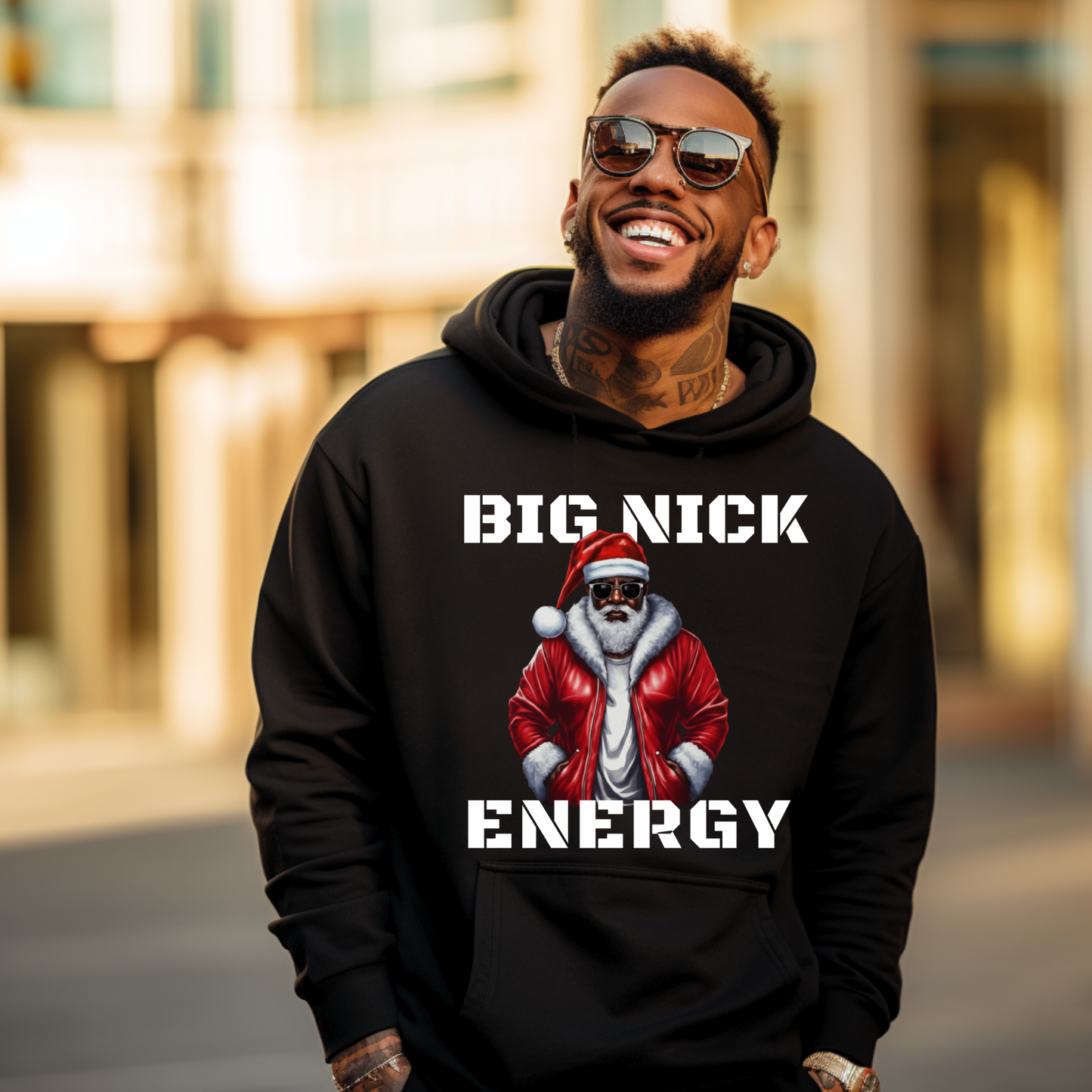 Man wearing a black hoodie with a graphic and text 'BIG NICK ENERGY' in an urban setting