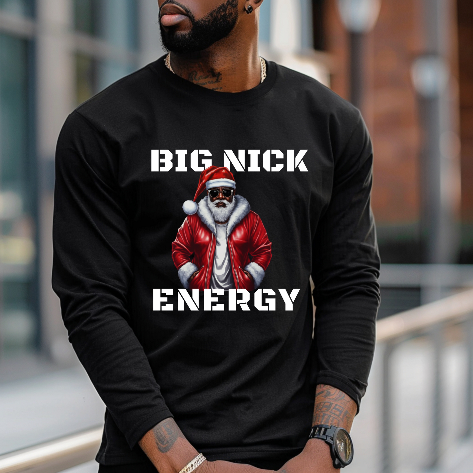 Person wearing a black long-sleeve shirt with a graphic and text 'BIG NICK ENERGY' in an urban setting.