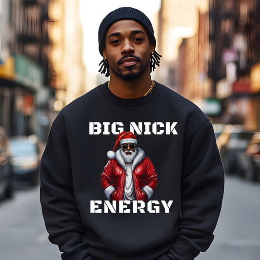 Person wearing a black sweatshirt with a graphic and text on a city street background