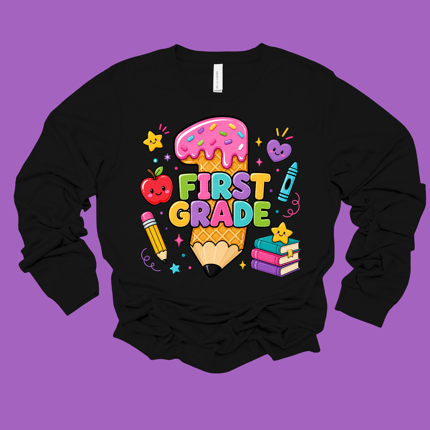 A black long-sleeve crewneck sweatshirt featuring a colorful 'FIRST GRADE' graphic on the chest, displayed against a solid purple background.