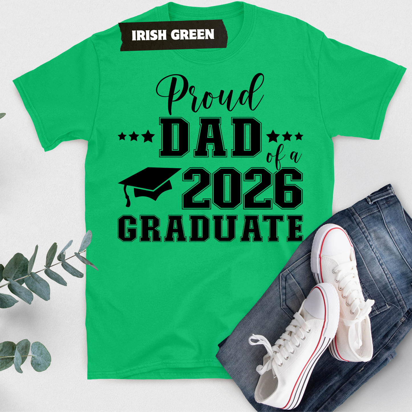 Green t-shirt with 'Proud Dad of a 2026 Graduate' text on a white background