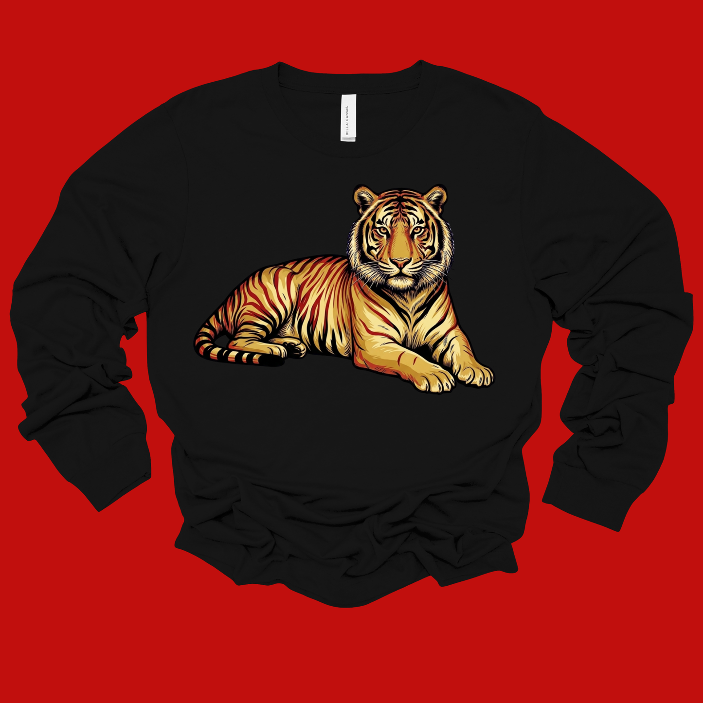 A black long-sleeve crewneck sweatshirt featuring a detailed graphic of a resting tiger on the front, displayed against a solid red background.