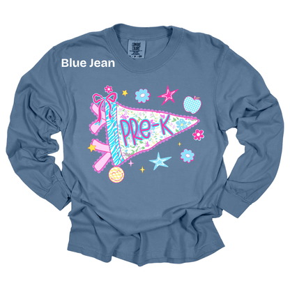 A blue long-sleeve t-shirt with a colorful 'Pre-K' pennant graphic on the front, featuring a pink ribbon, stars, and flowers. The text 'Blue Jean' is printed in white near the upper left chest.