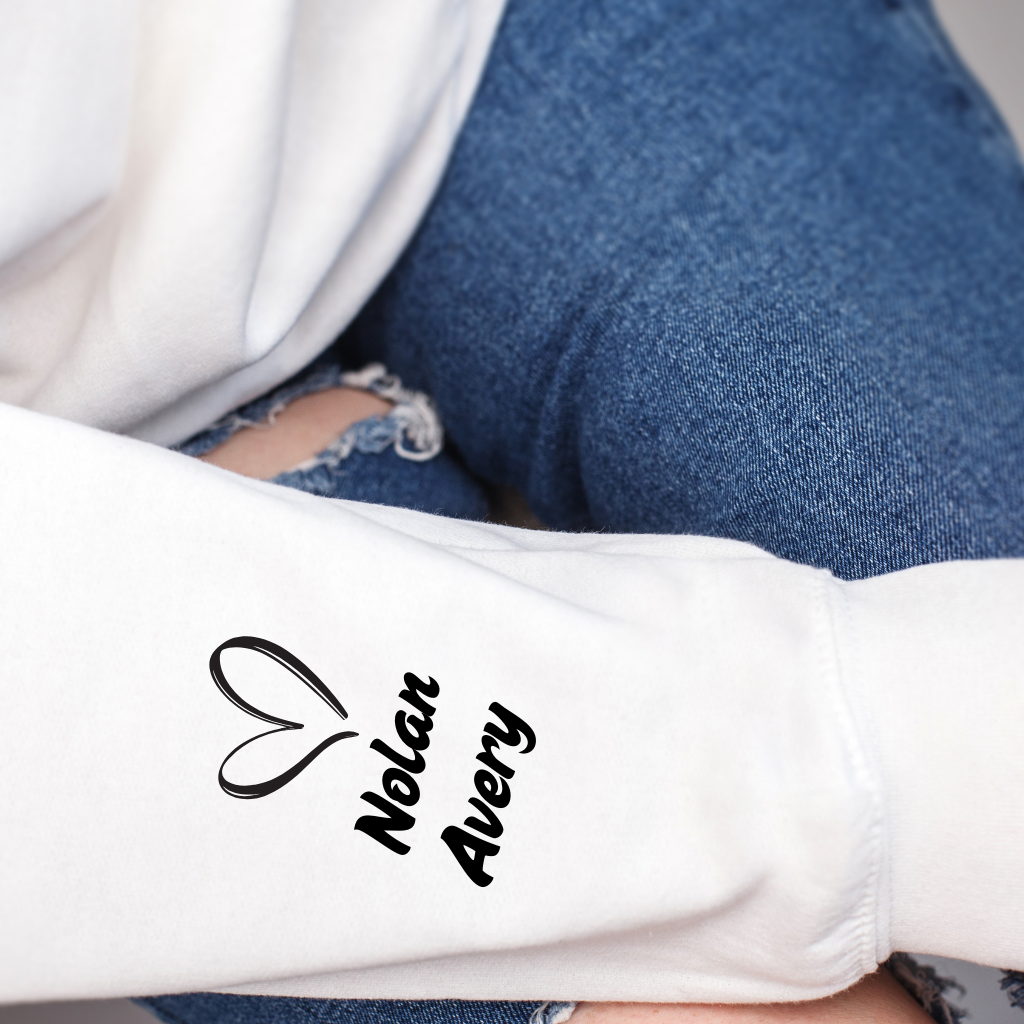Women wearing This mama prays olive green sweater emphasing a praying mama, a spiritual mama, a religious mama Sweatshirt with personalized children's name on the sleevWomen wearing This mama prays olive green sweater emphasing a praying mama, a spiritual mama, a religious mama Sweatshirt with personalized children's name on the sleeve which is a perfect mother's day gift for mom
