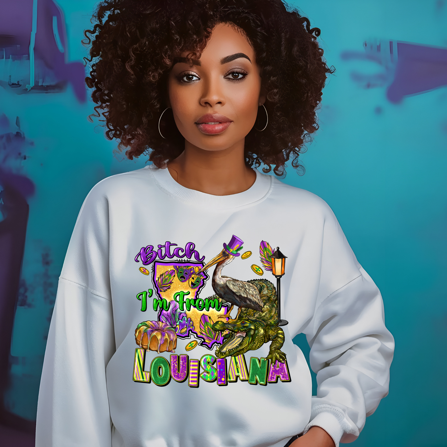 Woman wearing a white sweatshirt with a colorful graphic and text, standing against a blue background.