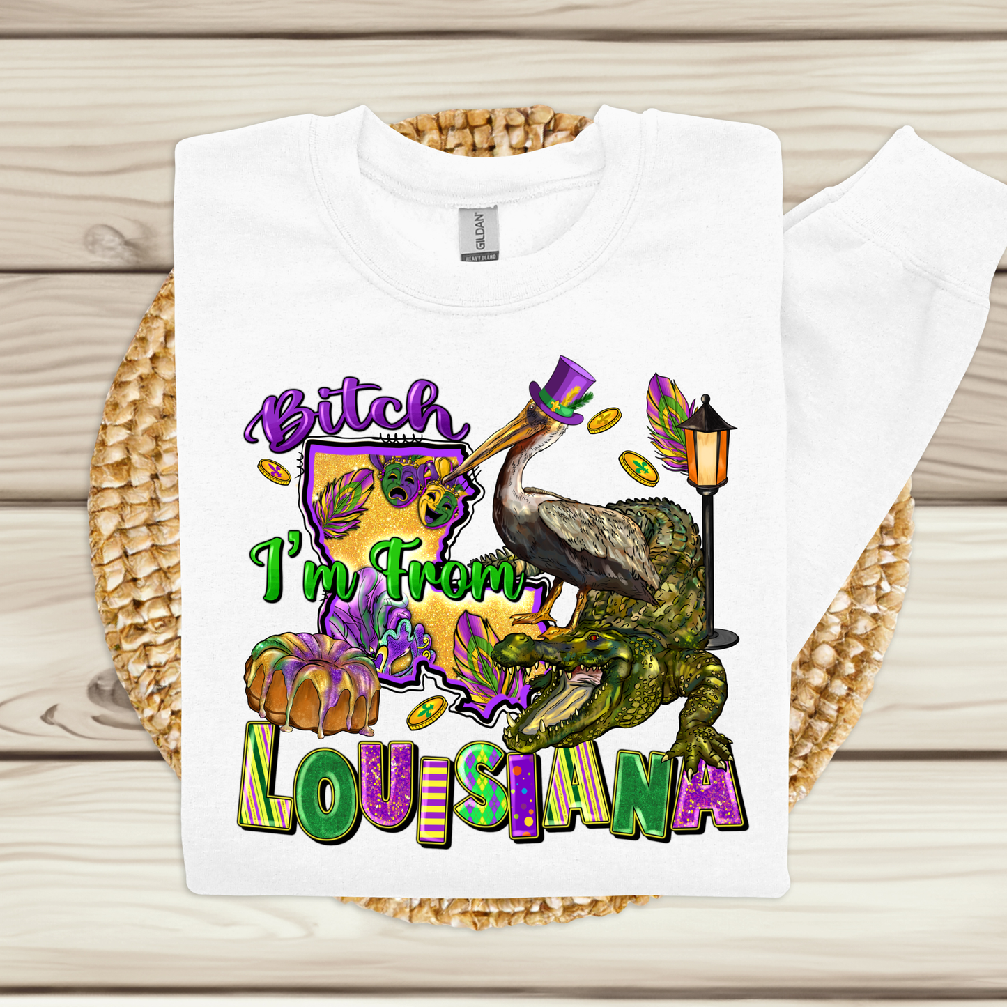 White t-shirt with colorful graphics and text on a wooden surface