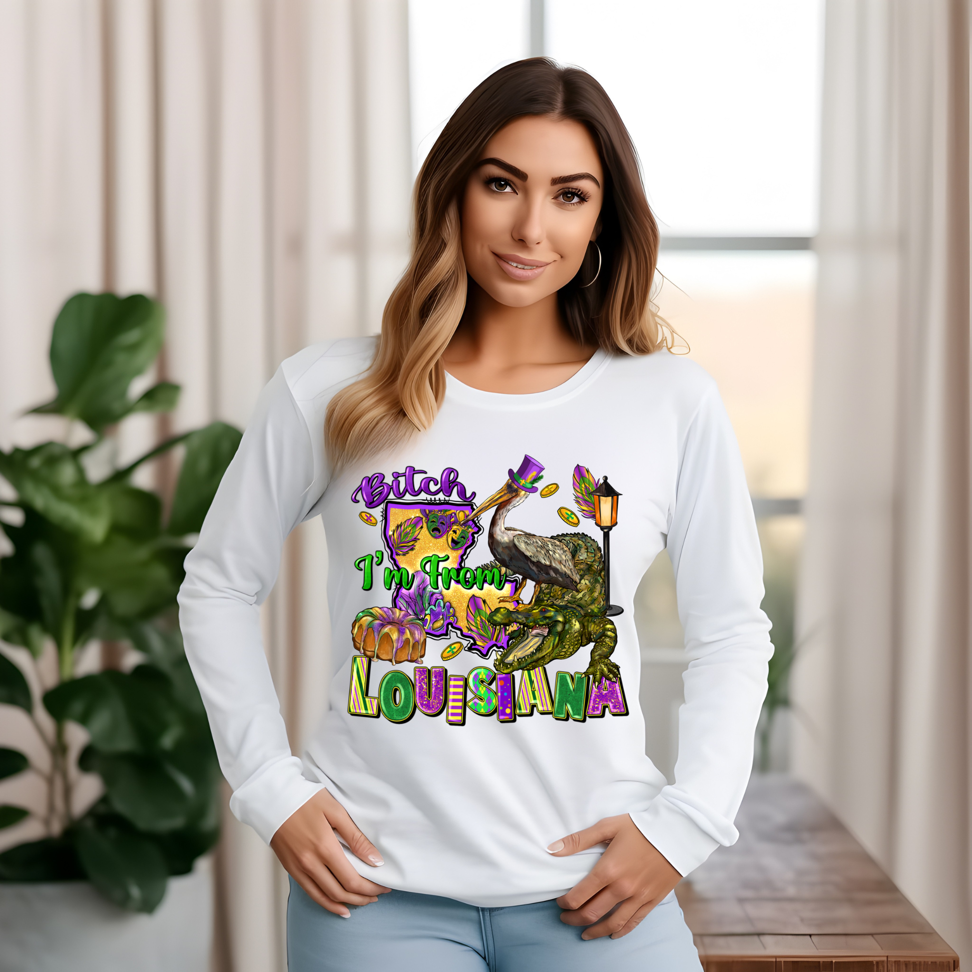 Woman wearing a white long-sleeve shirt with colorful graphics and text, standing indoors.