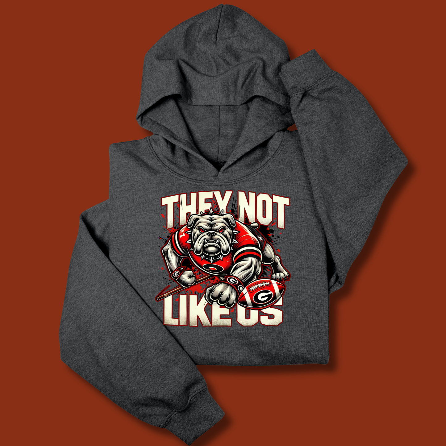 Gray hoodie with graphic design and text on a brown background