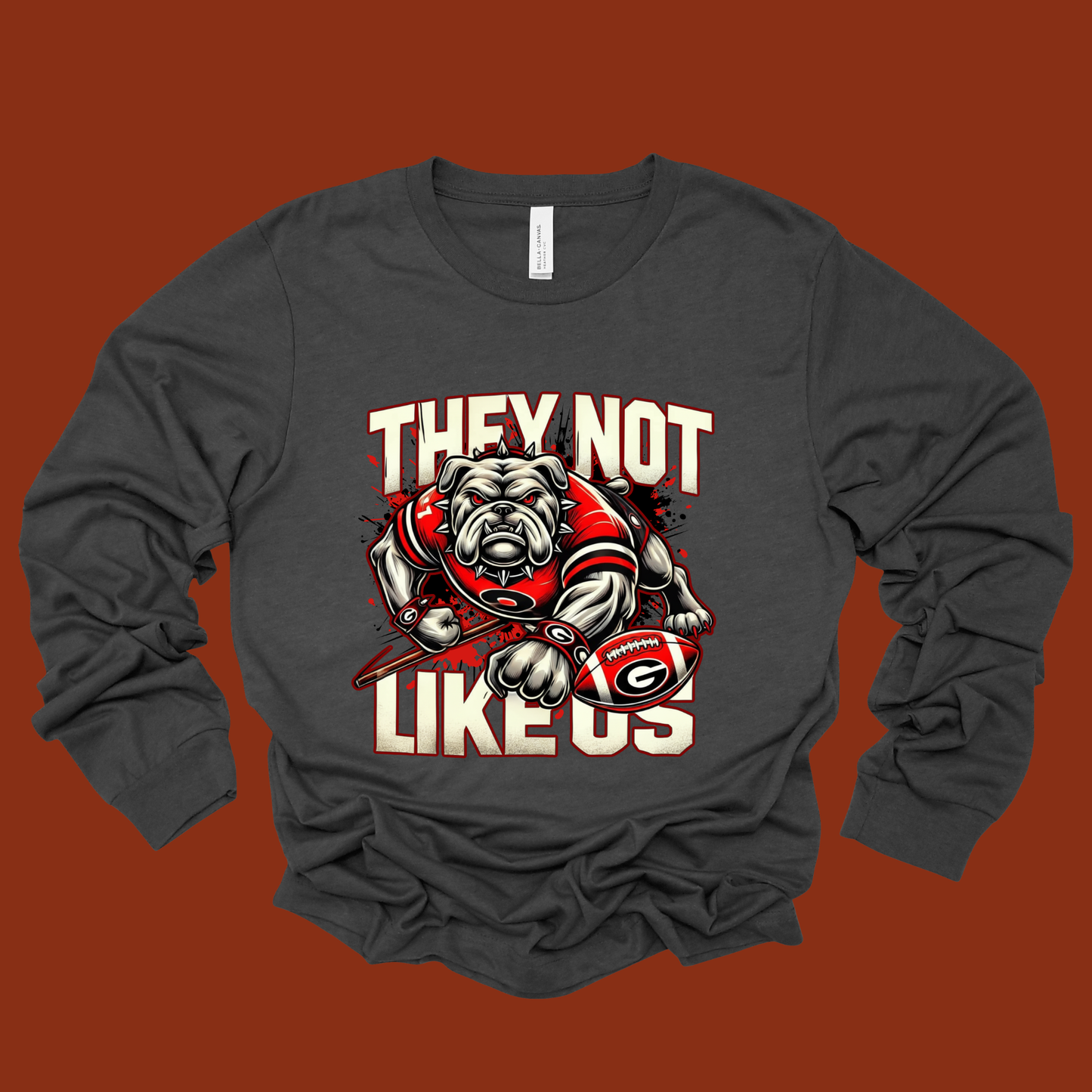 Gray long-sleeve shirt with bulldog graphic and text on a brown background