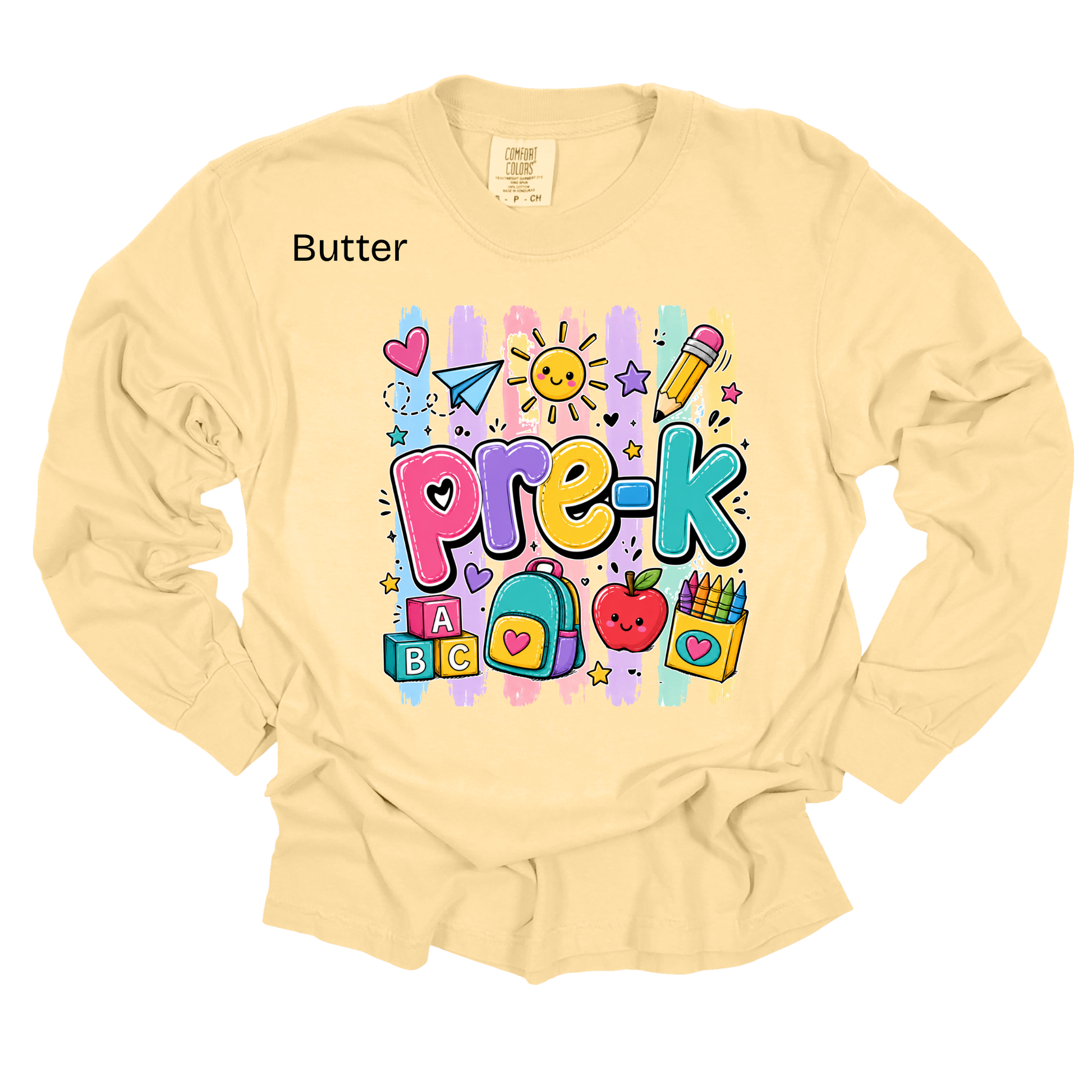 A pale butter-yellow long-sleeve t-shirt with a colorful 'Pre-K' cartoon graphic on the chest, featuring school-themed illustrations like pencils, a heart, and blocks. The word 'Butter' is printed in black near the left shoulder.
