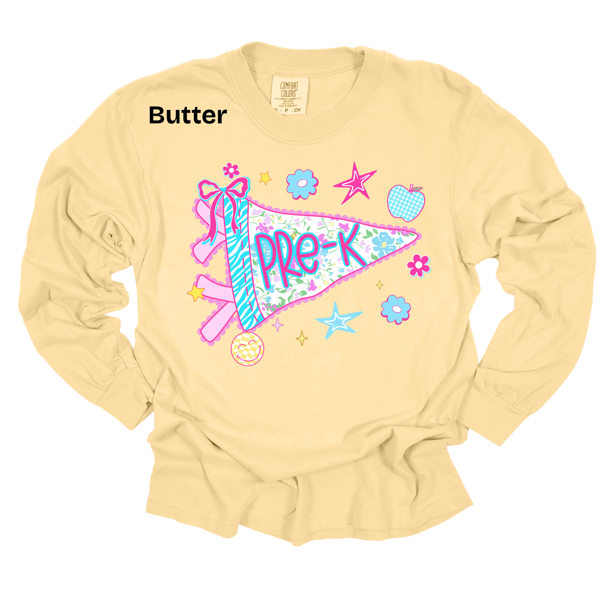 A pale butter-yellow long-sleeve t-shirt with a colorful graphic of a ribbon pennant and school-themed icons, featuring the text 'PRE-K' and a 'Butter' label near the collar.