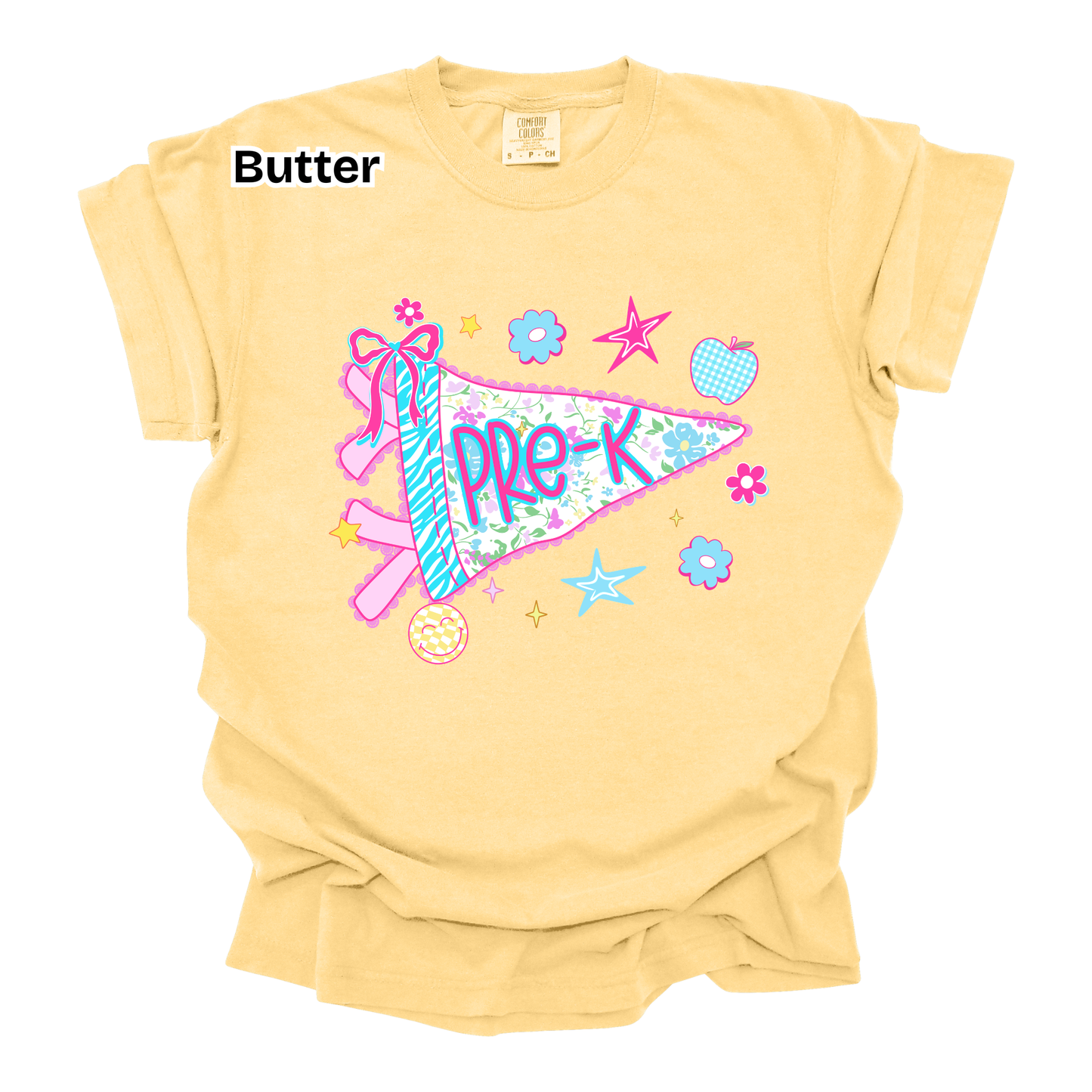 A pale butter-yellow short-sleeve t-shirt with a colorful graphic of a pennant flag reading 'PRE-K' decorated with a ribbon, stars, flowers, and a donut. The word 'Butter' is printed in black text in the upper left corner.