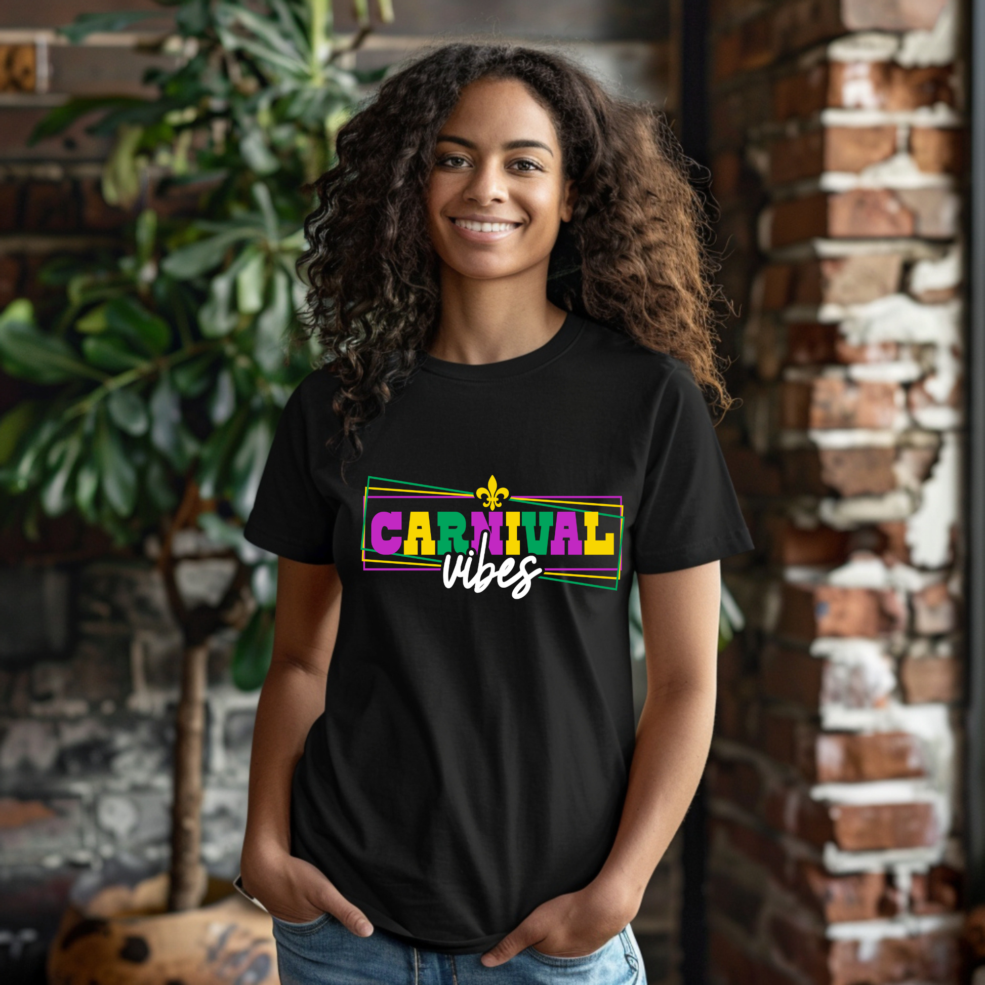 Person wearing a black t-shirt with 'Carnival vibes' text, standing in front of a brick wall.