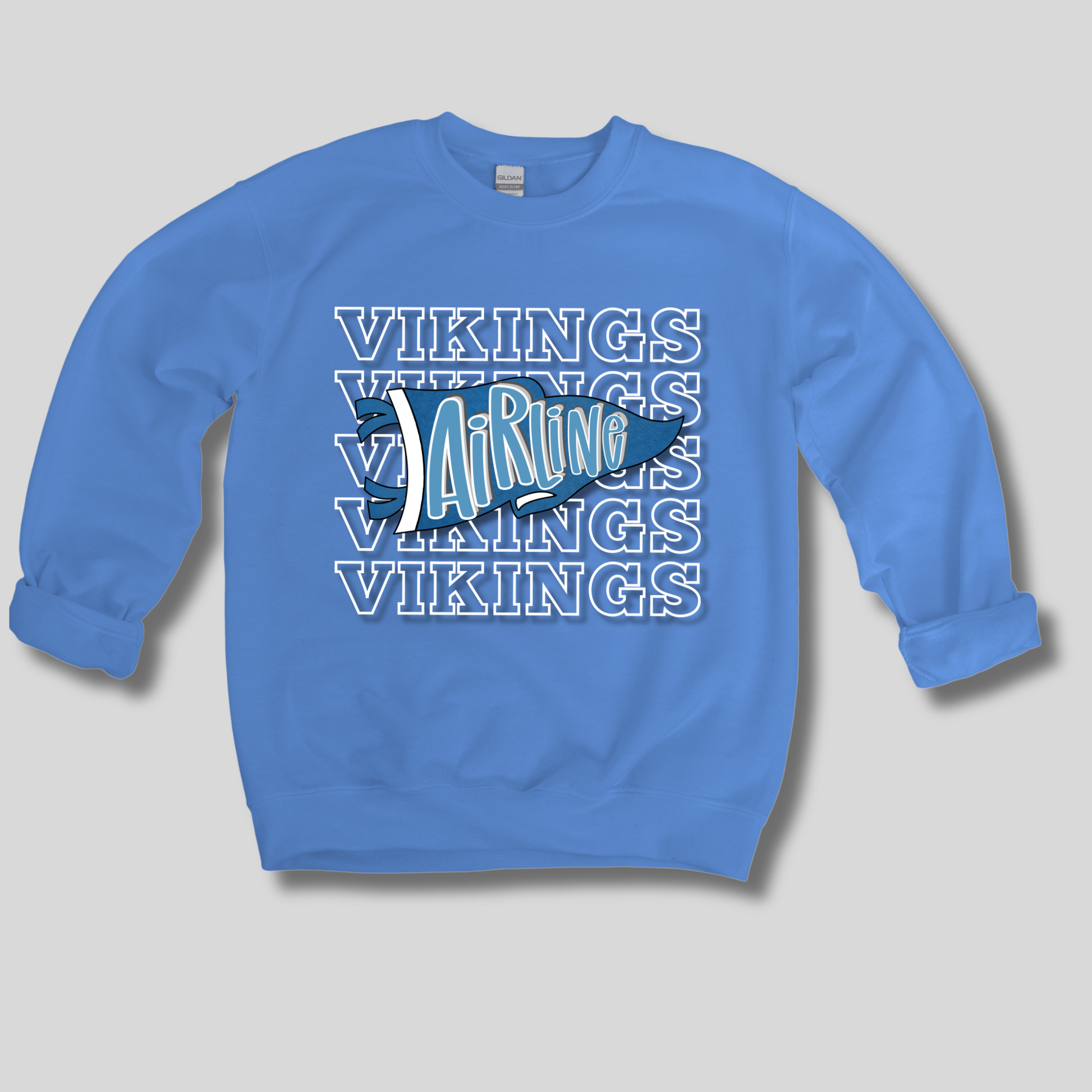 A light blue crewneck sweatshirt featuring a 'Vikings Airline' graphic on the chest, displayed against a neutral gray background.
