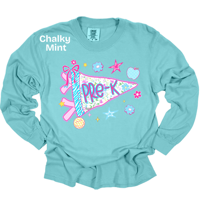 A light aqua long-sleeve t-shirt with a colorful 'Pre-K' pennant graphic on the front, featuring a ribbon, stars, and flowers. The text 'Chalky Mint' is printed on the upper left chest.
