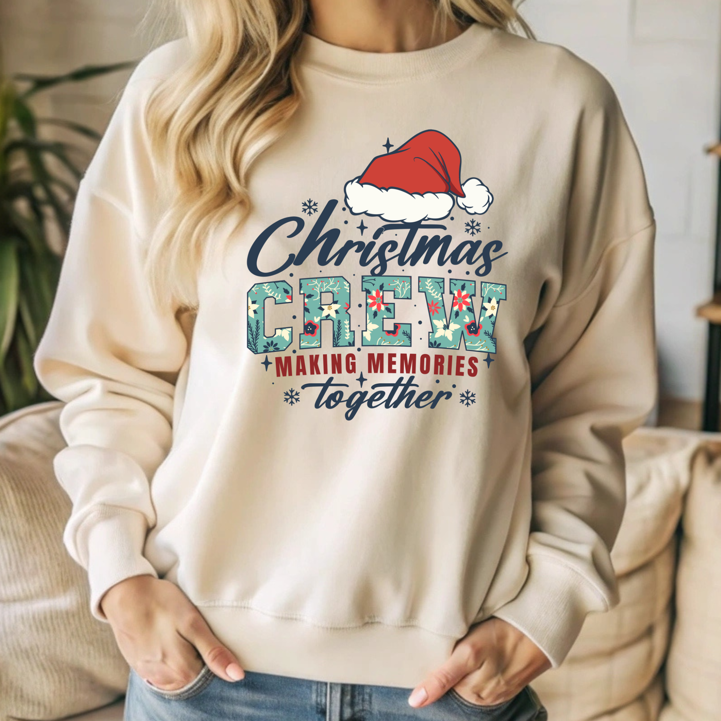 Beige sweatshirt with Christmas-themed design featuring a Santa hat and text.