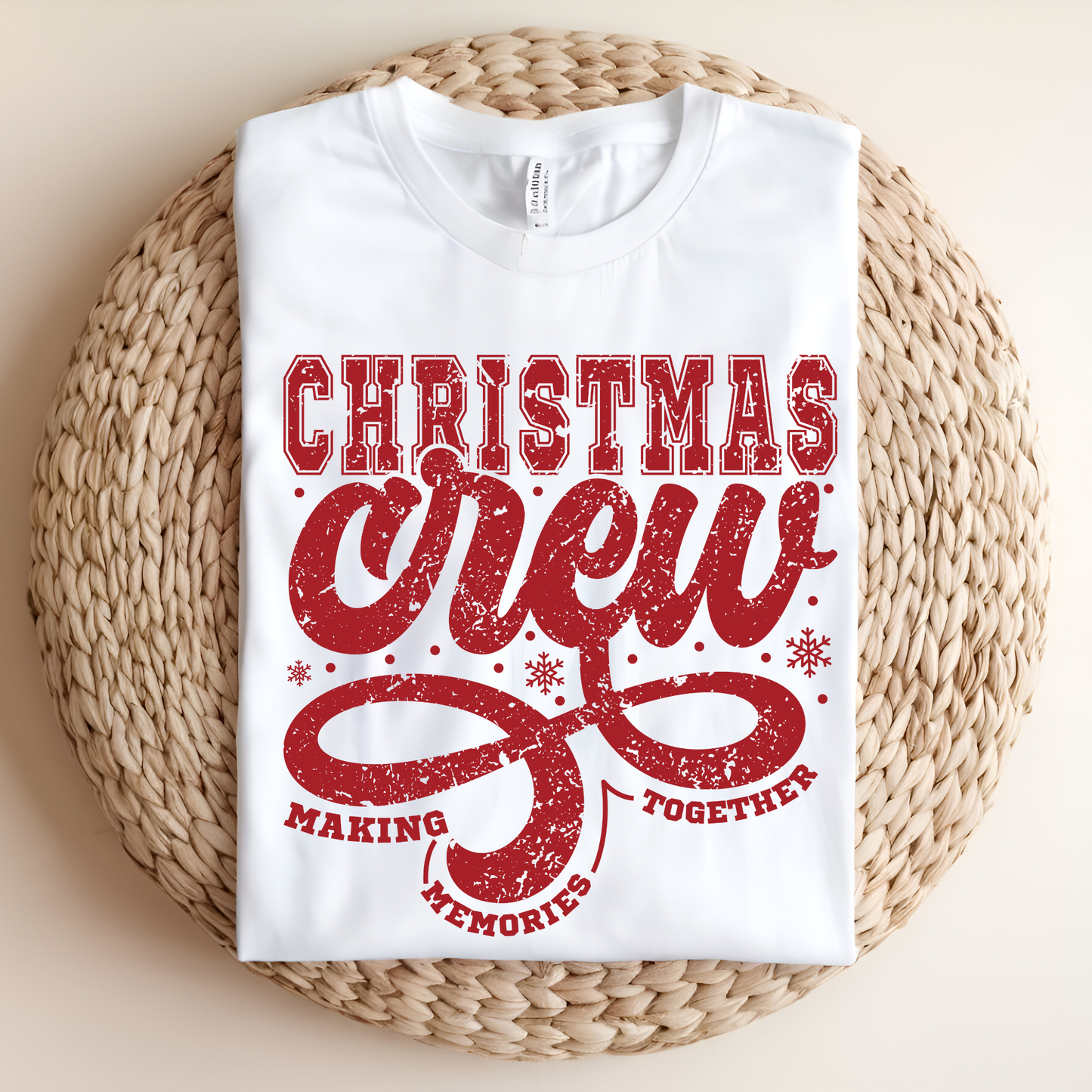 White t-shirt with red text 'Christmas crew making memories together' on a woven surface.  Christmas Crew Making Memories Together T-Shirt - Family Matching Holiday Sweater