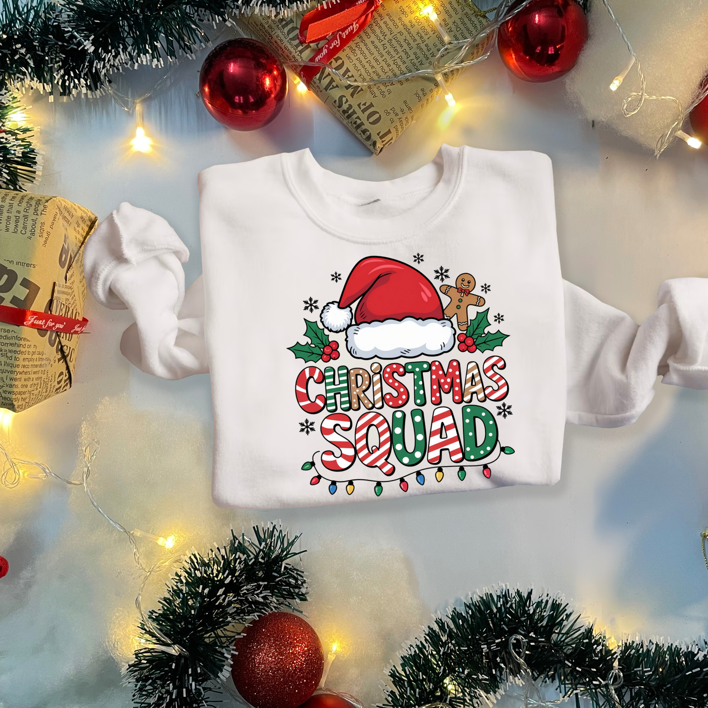 White sweatshirt with 'Christmas Squad' design surrounded by Christmas decorations on a light background  Matching Family Christmas Squad Shirt - Christmas Squad Family Matching T-Shirt