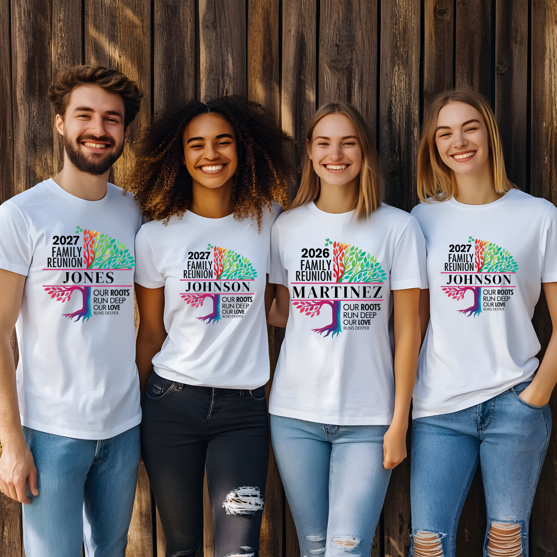 Four people wearing white t-shirts with colorful family reunion designs against a wooden background.