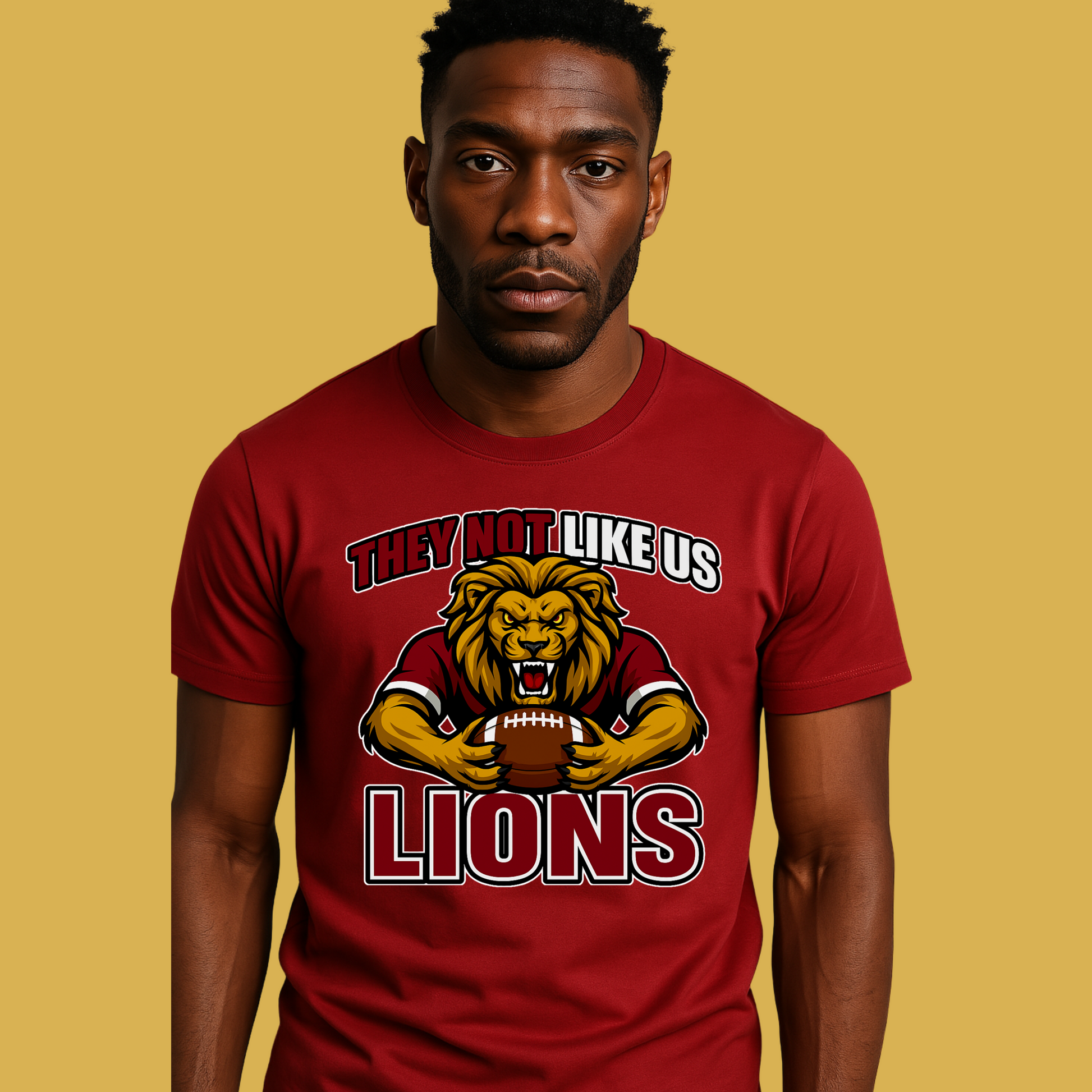 Man wearing a red t-shirt with a lion graphic and text on a yellow background Custom Mascot Shirt - Lions They Not Like Us Game Day Spirit Tee