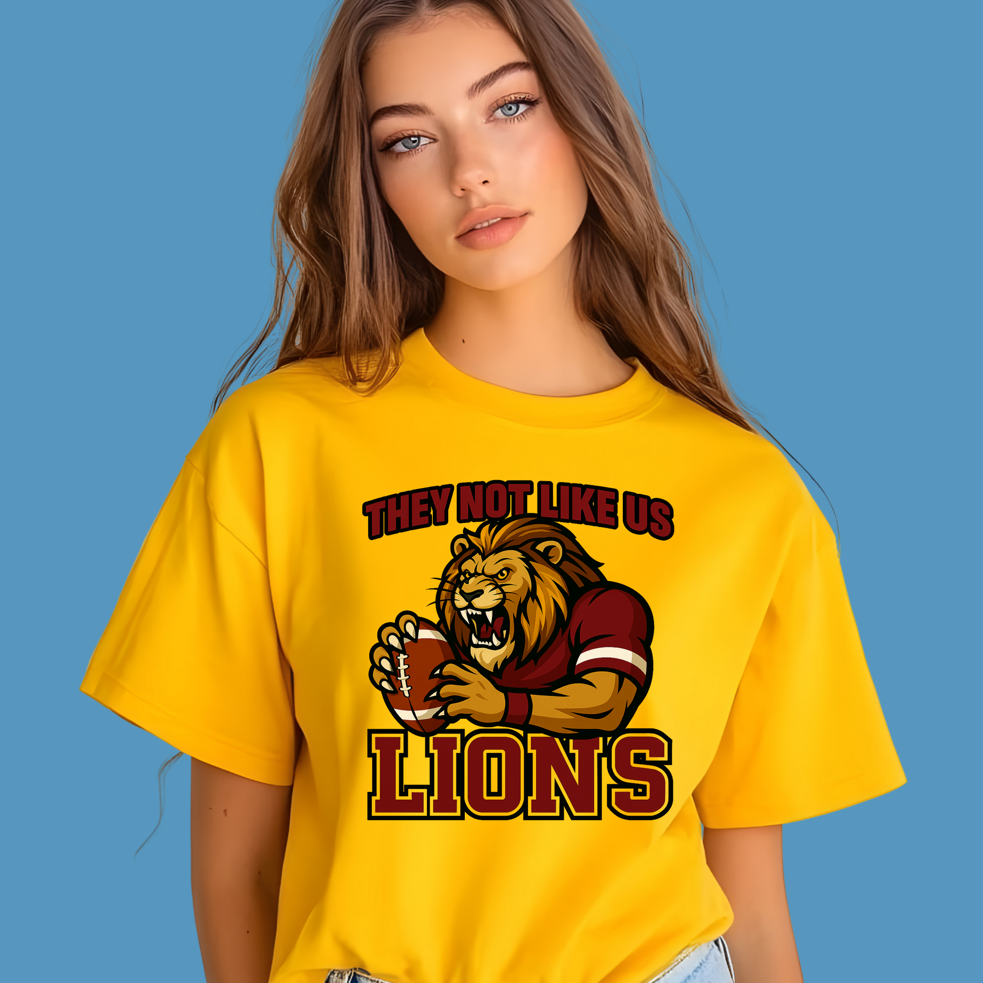 Person wearing a yellow t-shirt with a lion graphic and text on a blue background Custom Mascot Shirt - Lions They Not Like Us Version 2 School Spirit Tee