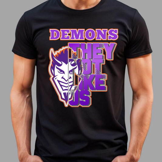 Black t-shirt with a graphic design featuring text and a demon-like face on a gray background NSU Demons T-Shirt- Demons They Not Like Us Game Day Graphic Tee