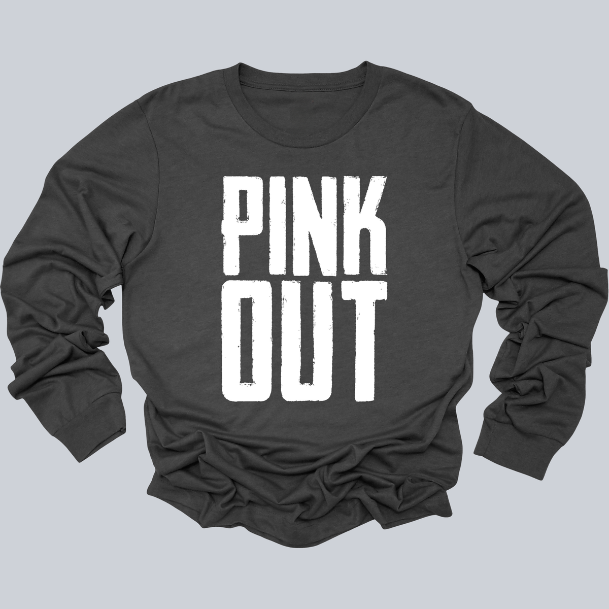 A dark charcoal gray long-sleeve t-shirt with the words 'PINK OUT' printed in a bold, distressed white font on the front, displayed against a solid light gray background.