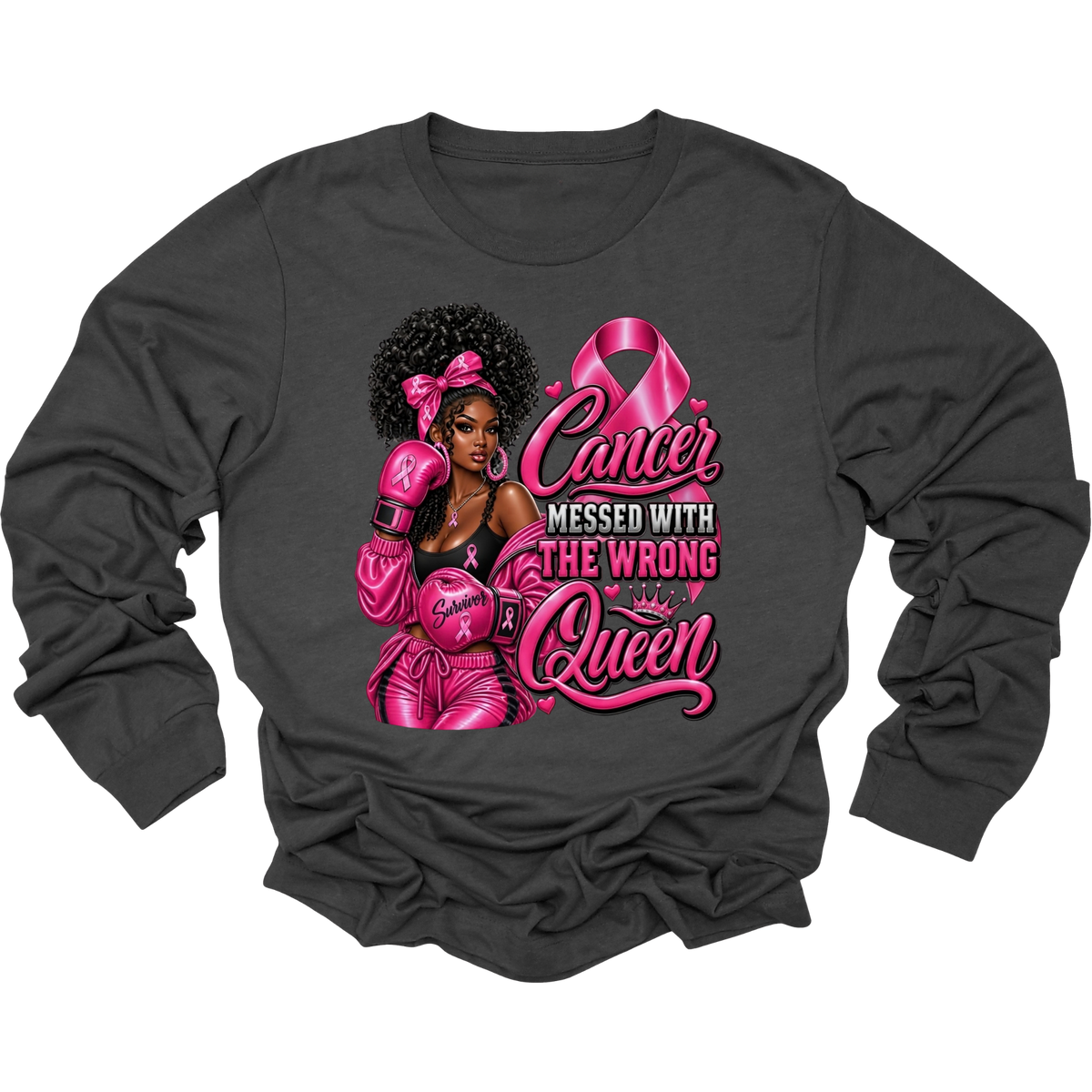 A dark charcoal gray long-sleeve t-shirt with a large graphic print on the front. The graphic features a stylized illustration of a woman with an afro wearing pink boxing gear, alongside a pink breast cancer ribbon and the text 'Cancer MESSED WITH THE WRONG Queen' in pink and white script.