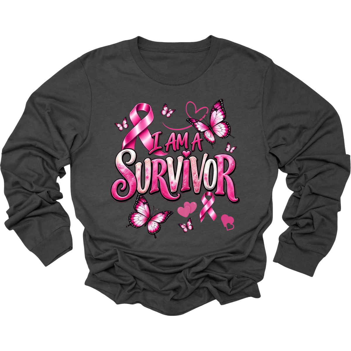 A dark charcoal gray long-sleeve t-shirt with a graphic print on the front that reads 'I AM A SURVIVOR' in pink and white bubble letters, decorated with pink breast cancer awareness ribbons, butterflies, and hearts.