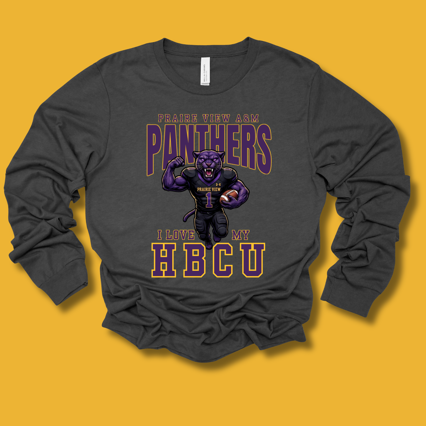 A dark charcoal gray long-sleeve t-shirt with a graphic print of a purple panther mascot and the text 'PRAISE WHEN I SEE PANTHERS I LOVE WHEN I SEE HBCU', displayed on a solid yellow background.
