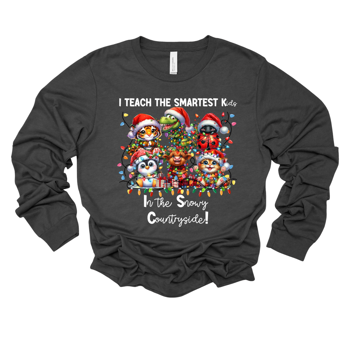 A dark charcoal gray long-sleeve t-shirt with a festive Christmas graphic of cartoon penguins in Santa hats, displayed on a clean white background.