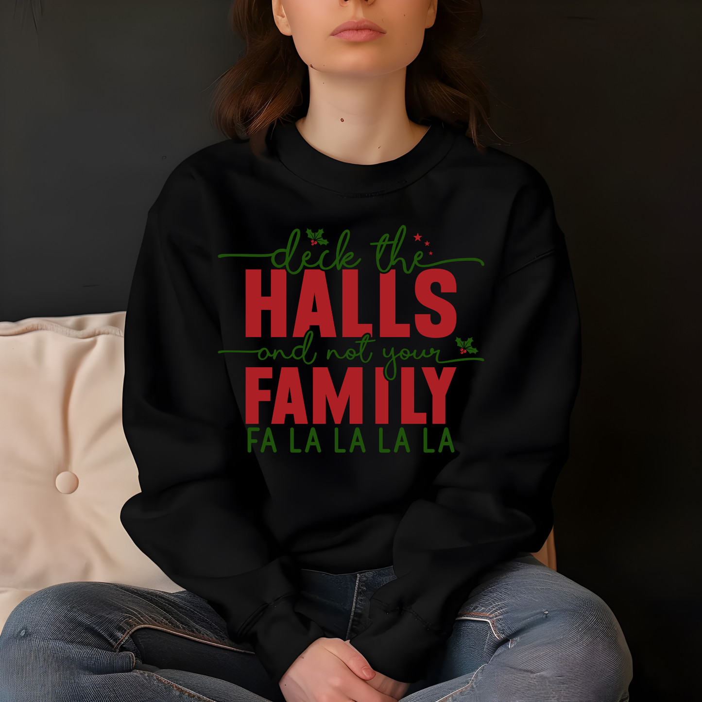 Person wearing a black sweatshirt with festive text design.
