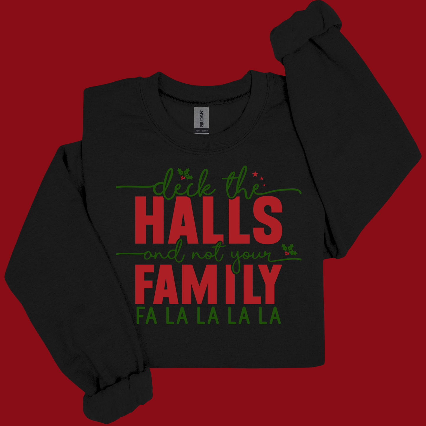 Black sweatshirt with Christmas-themed text on a red background