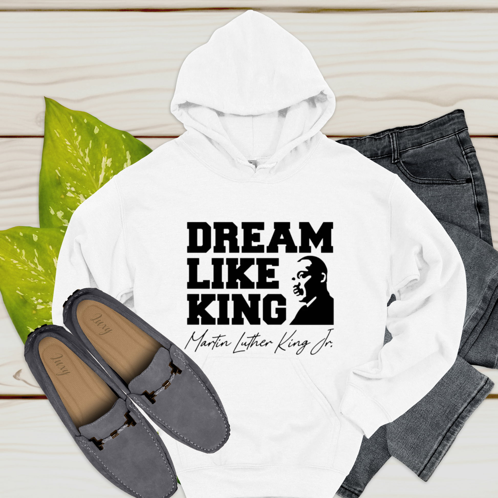 black women wearing a white hoodie with the phrase "DREAM LIKE KING" and an image of Martin Luther King Jr., celebrating Black heritage and empowerment.