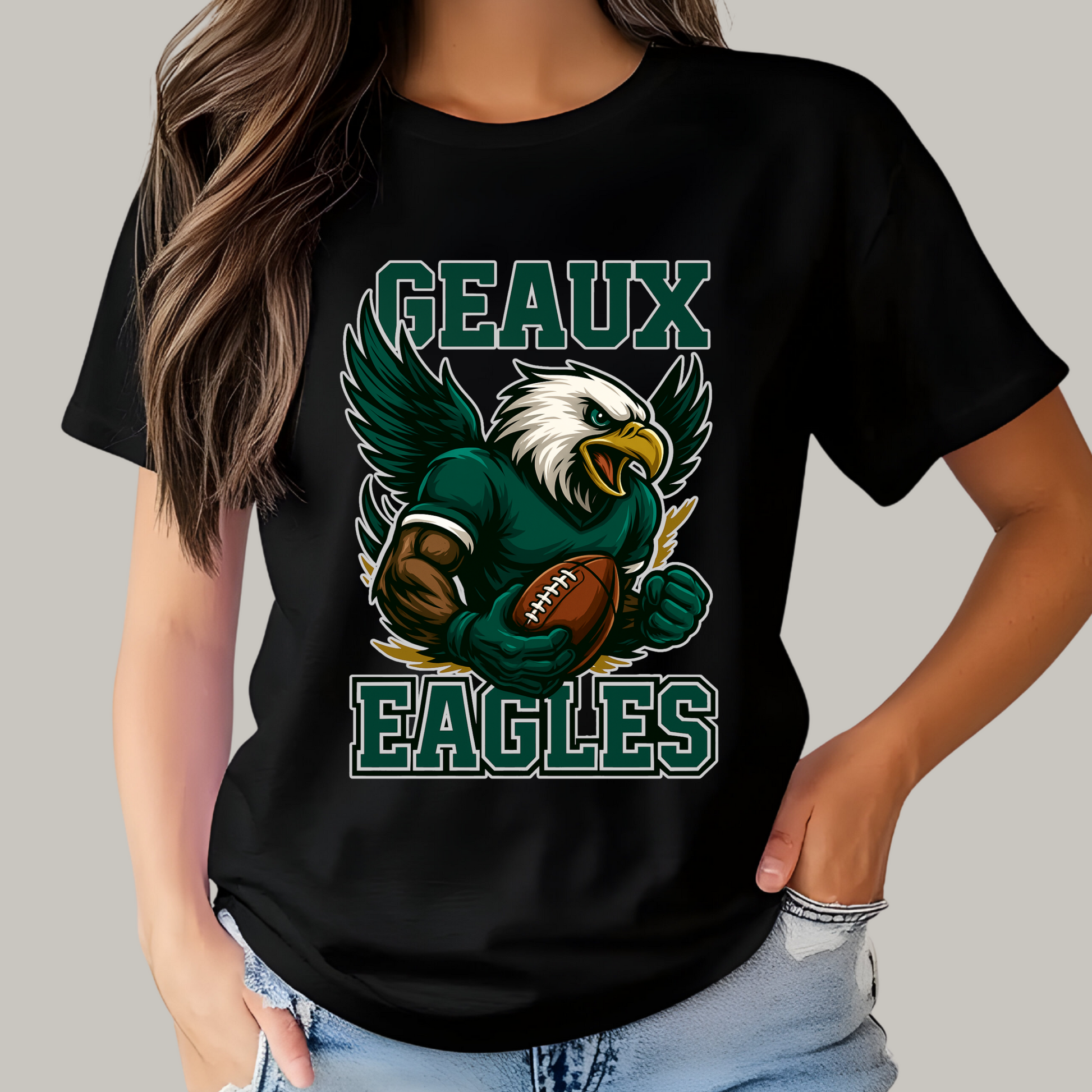 Person wearing a black t-shirt with an eagle graphic and 'GEAUX EAGLES' text. Eagles Mascot Shirt - Geaux Eagles Game Day Team Spirit Shirt