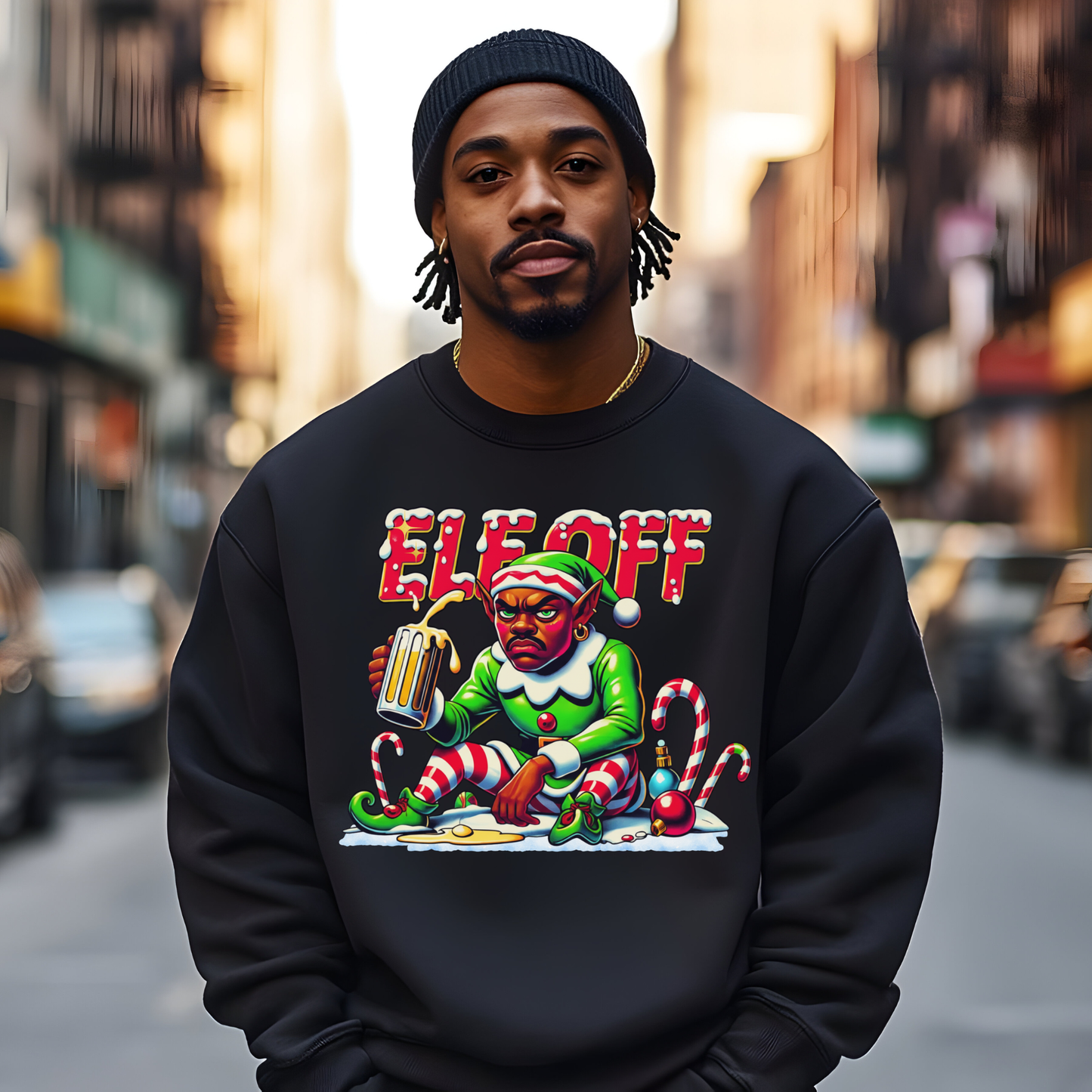 Person wearing a black sweatshirt with a colorful graphic design on a city street.