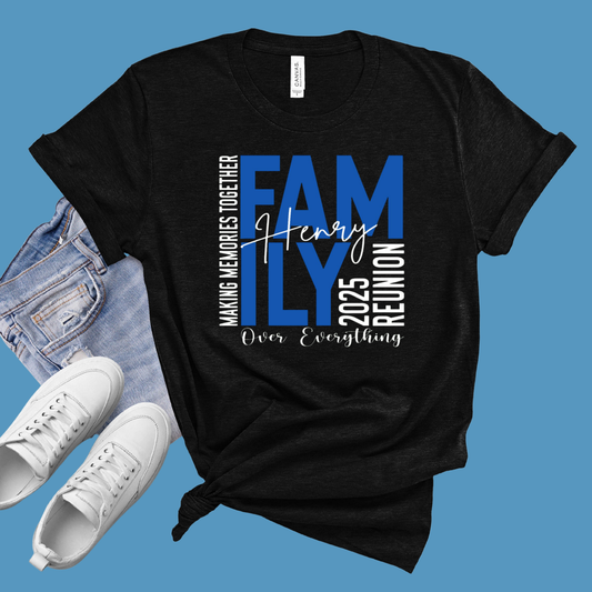 Black t-shirt with family reunion text, white sneakers, and denim jacket on a blue background