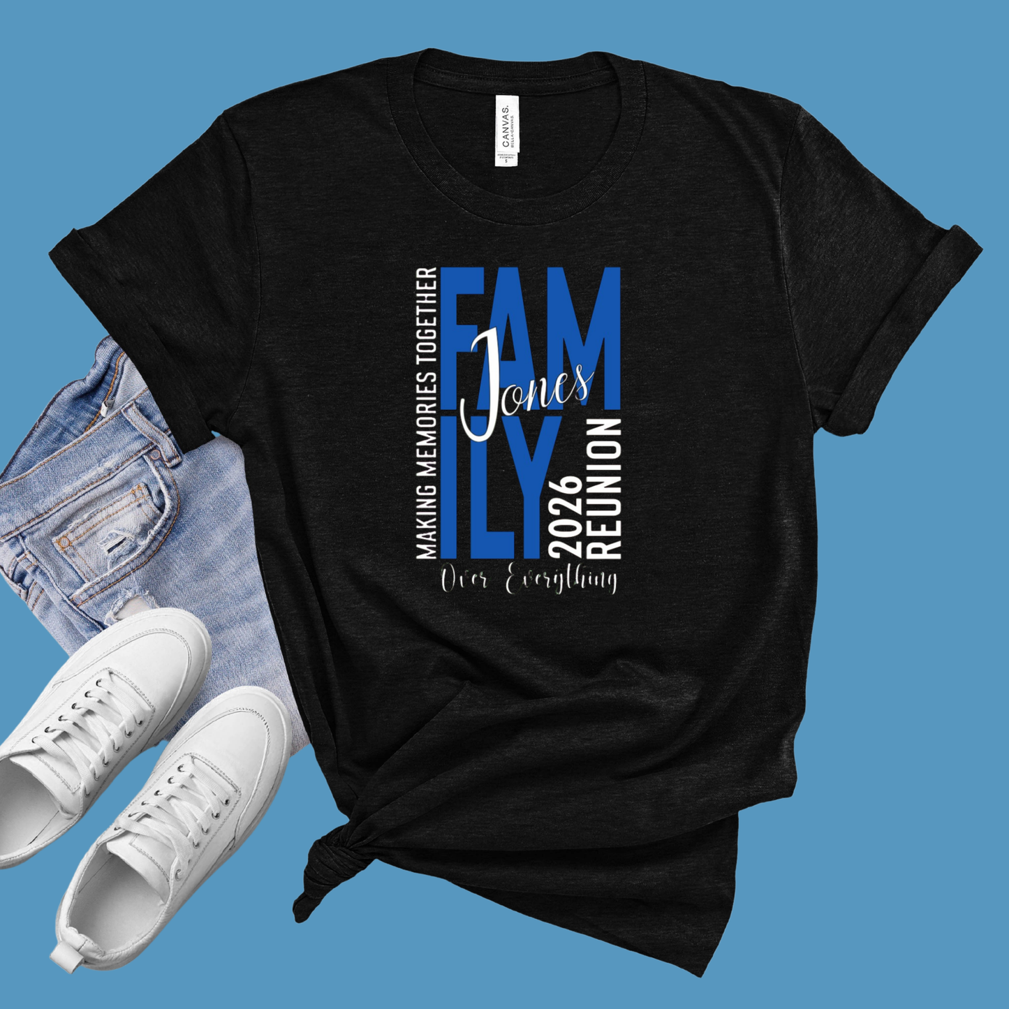 Black t-shirt with family reunion text, white sneakers, and denim jeans on a blue background