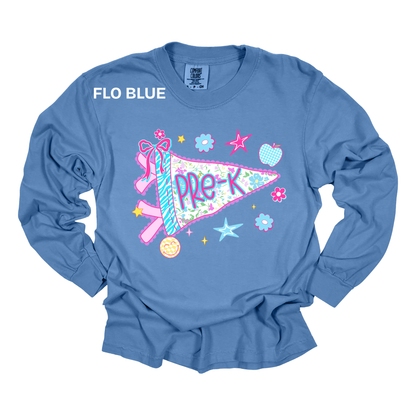 A long-sleeve t-shirt in a dusty blue color, featuring a colorful graphic of a pink and blue pre-K pennant flag with the words 'PRE-K' and 'FLO BLUE' printed on the chest.