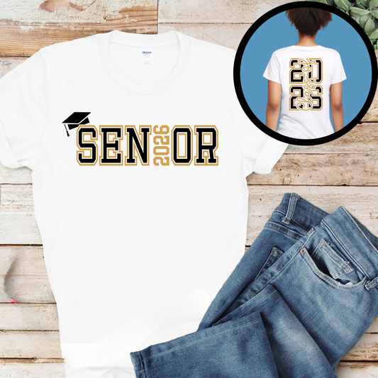 White t-shirt with 'SENIOR' design on a wooden surface with jeans.
