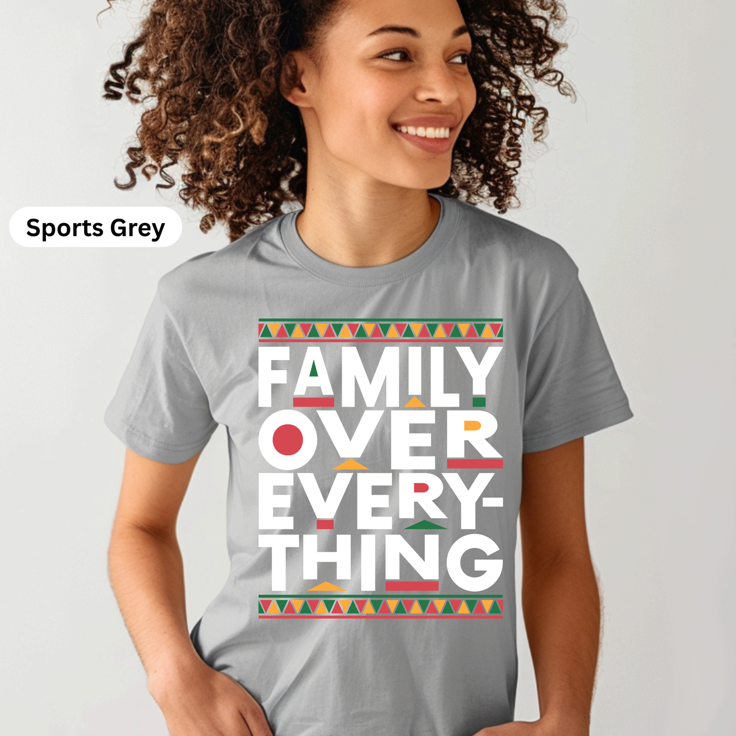Person wearing a gray t-shirt with 'Family Over Everything' text design on a plain background