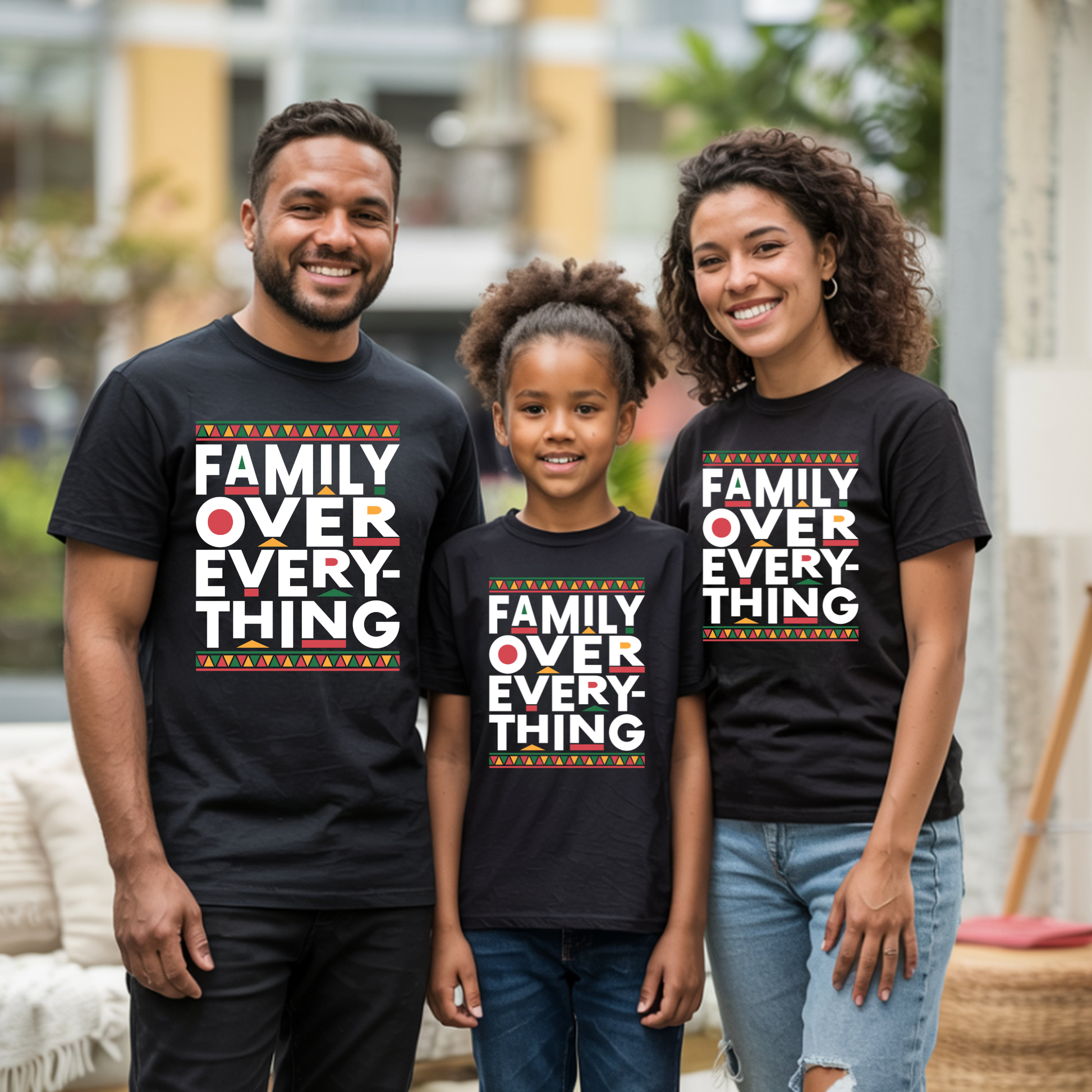 Family wearing matching black t-shirts with 'Family Over Everything' text.
